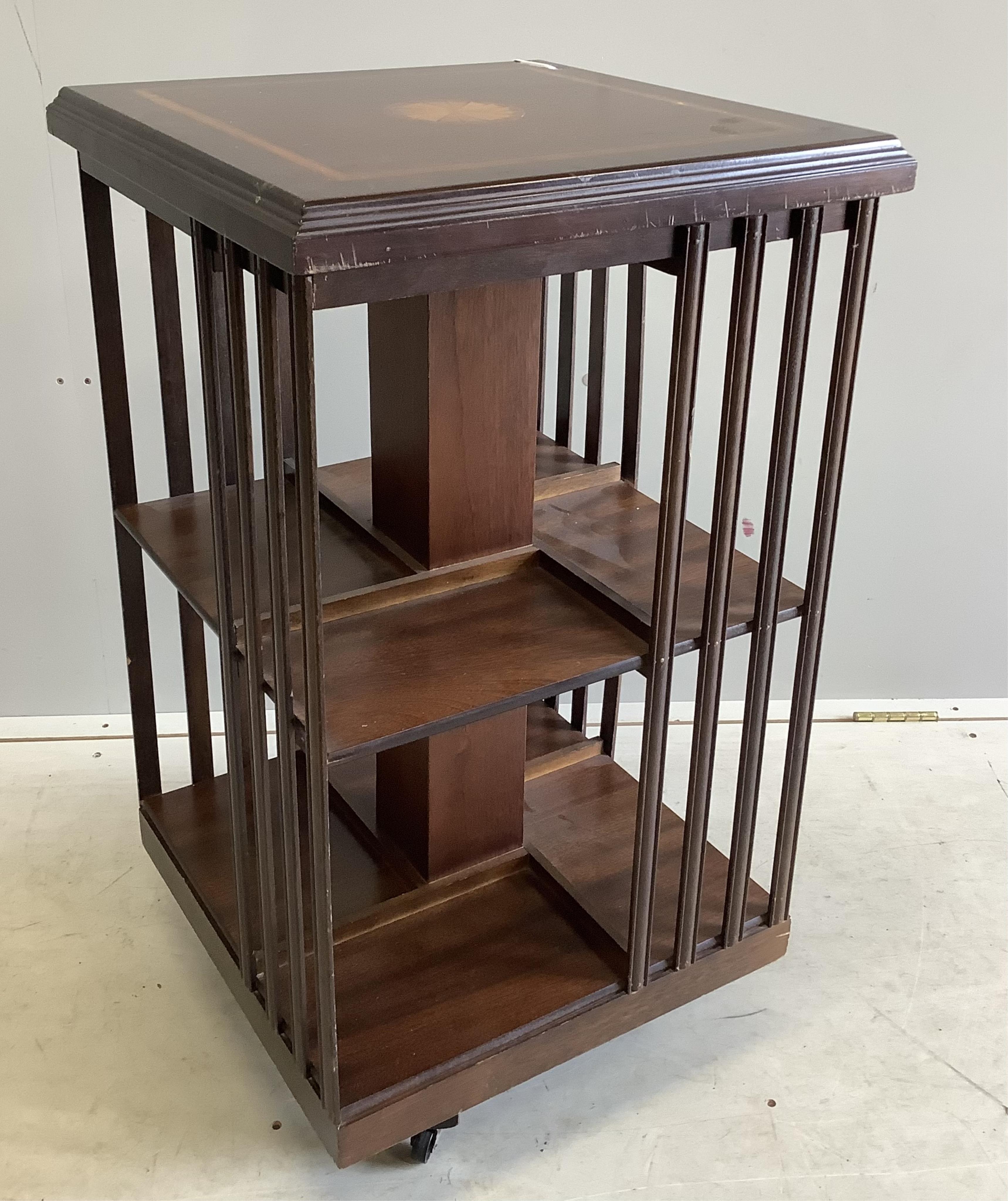 An Edwardian style inlaid mahogany revolving bookcase, width 47cm, depth 47cm, height 85cm. Condition - fair to good